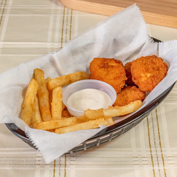 A basket of golden-brown fries and crispy fried cheese curds with a side of ranch dressing.